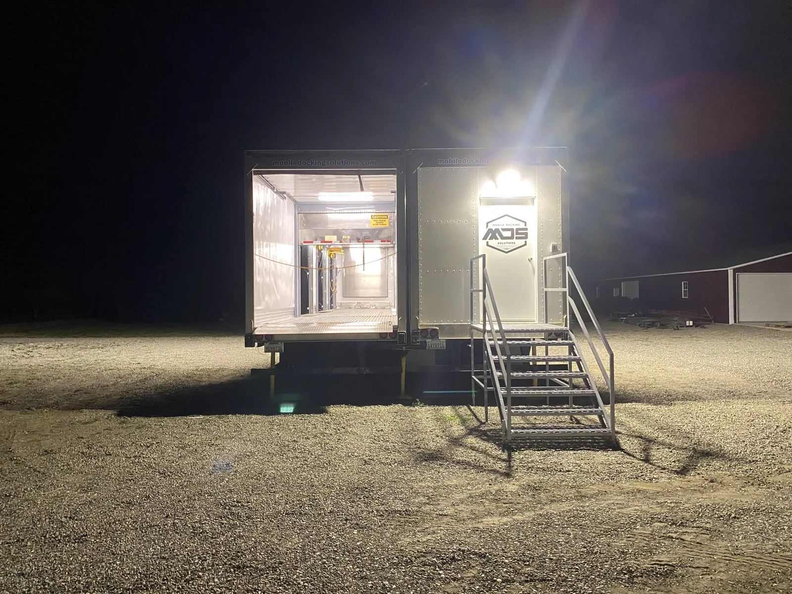 Illuminated end entry and stair platform at night