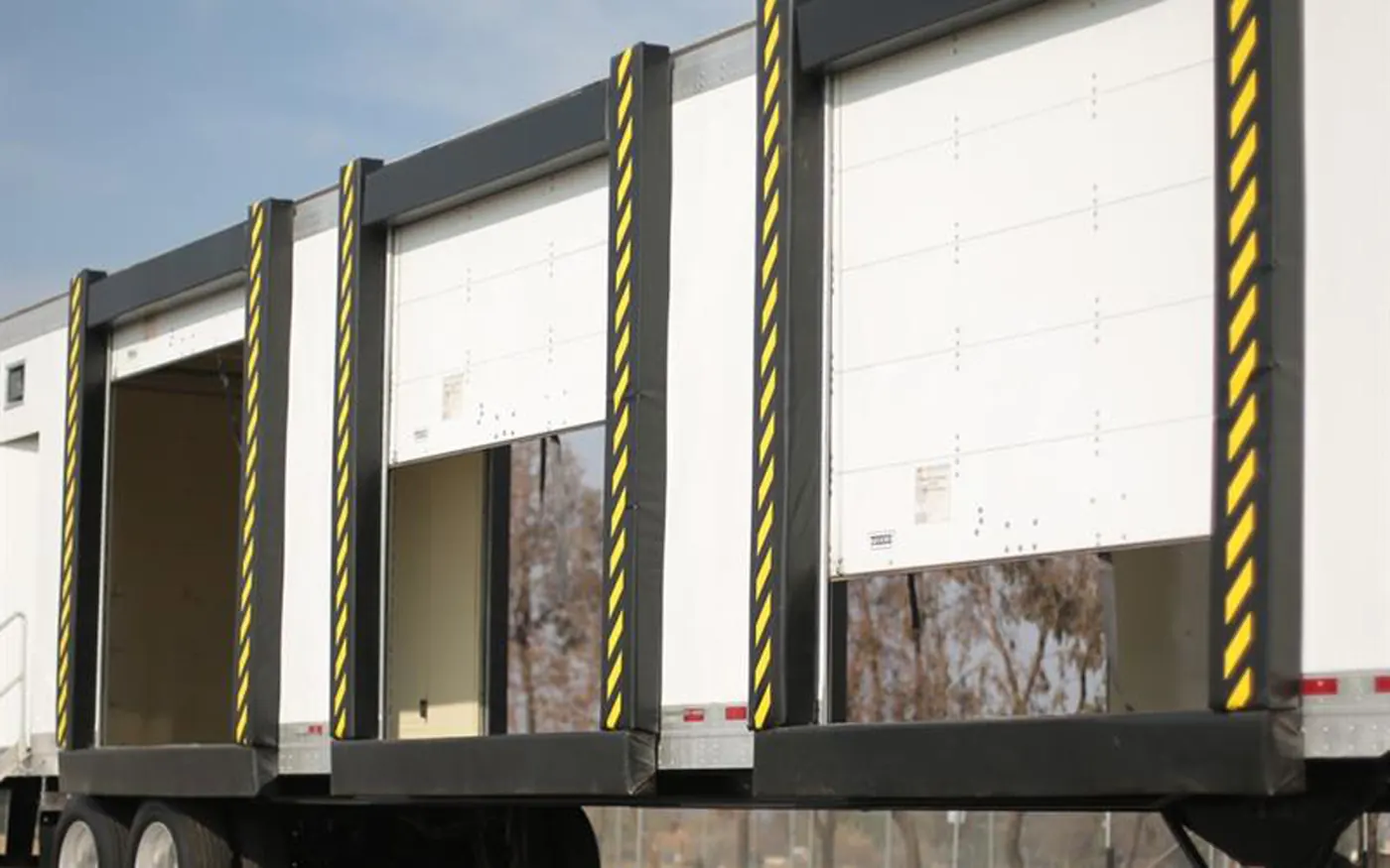 Multiple roll-up dock openings with full-height dock seals