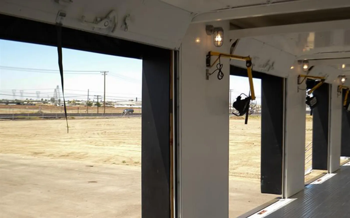 Open roll-up door positions with adjustable dock lighting