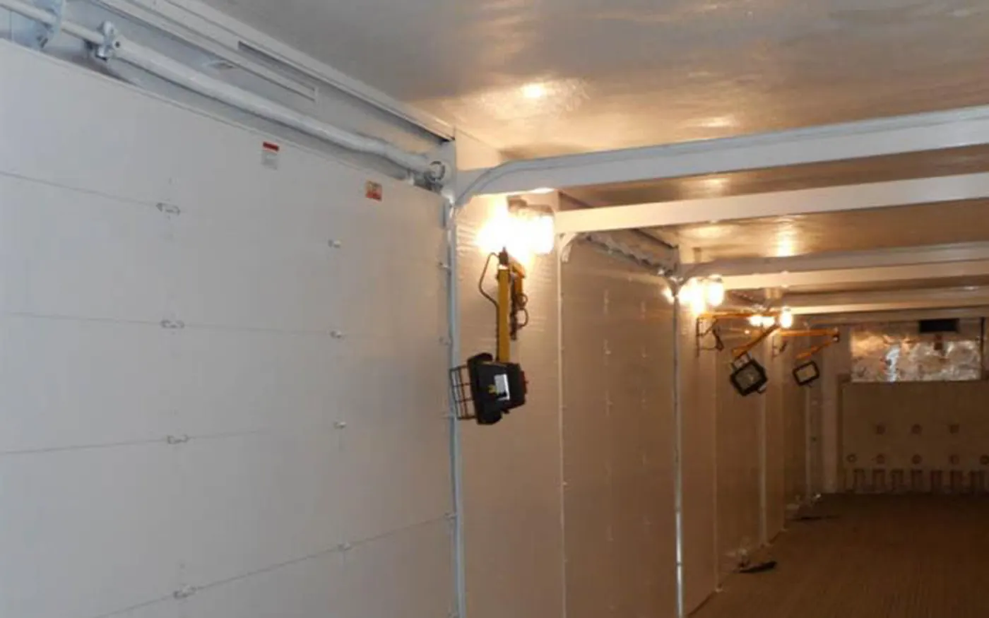 Reinforced mobile dock interior with lighting and roll-up doors